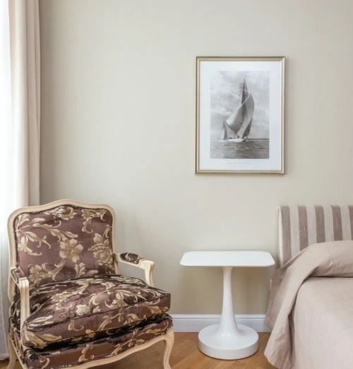 Canva - Armchair with cushion in bedroom_